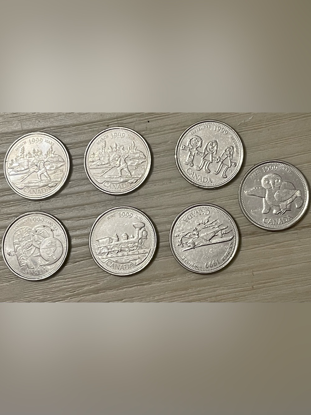 Canadian 25 Coin 1999 with Commemorative Motifs